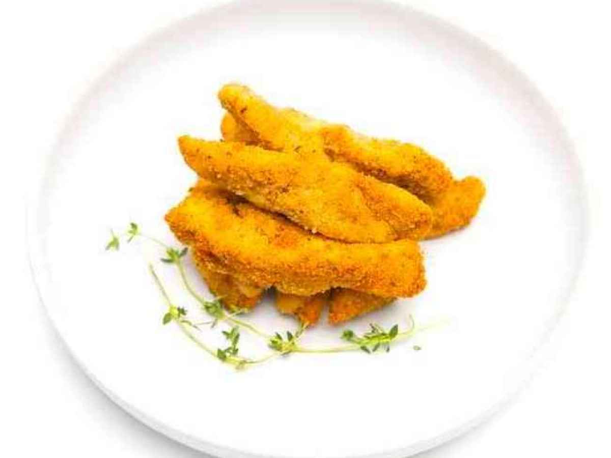 a plate of food Made with chicken breast, herbs & breadcrumbs.