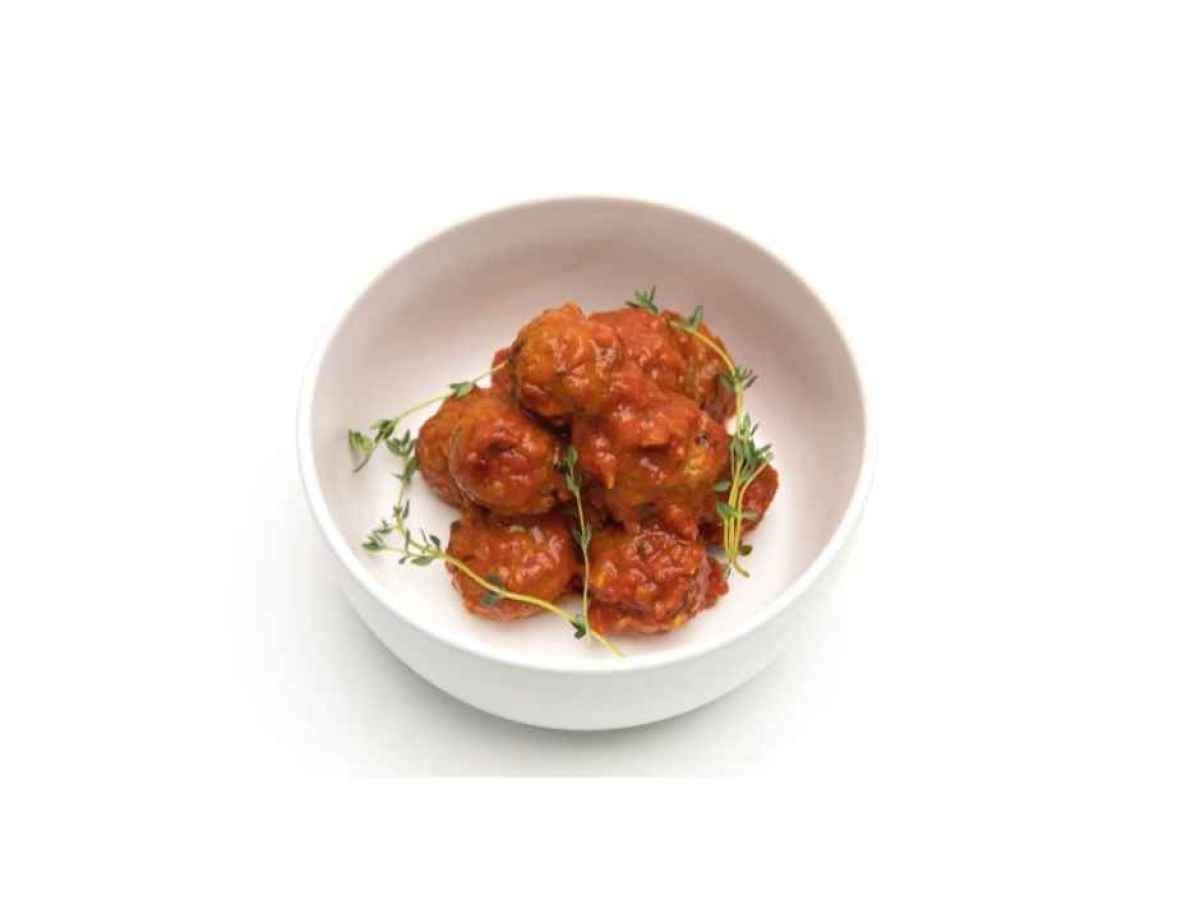 a bowl of food on a plate Made with ground beef, peppers, onions, herbs, and tomato sauce. Gluten Free.