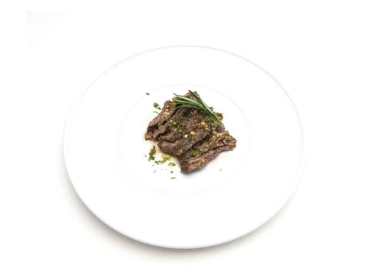 a plate of food Made with skirt steak, parsley, cilantro, garlic, and olive oil. Gluten Free.