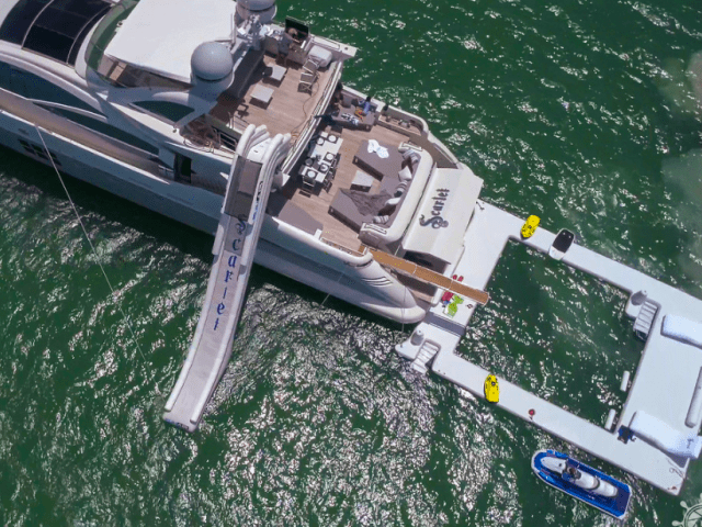 Floating lounge beside yacht on 103′ Azimut Miami