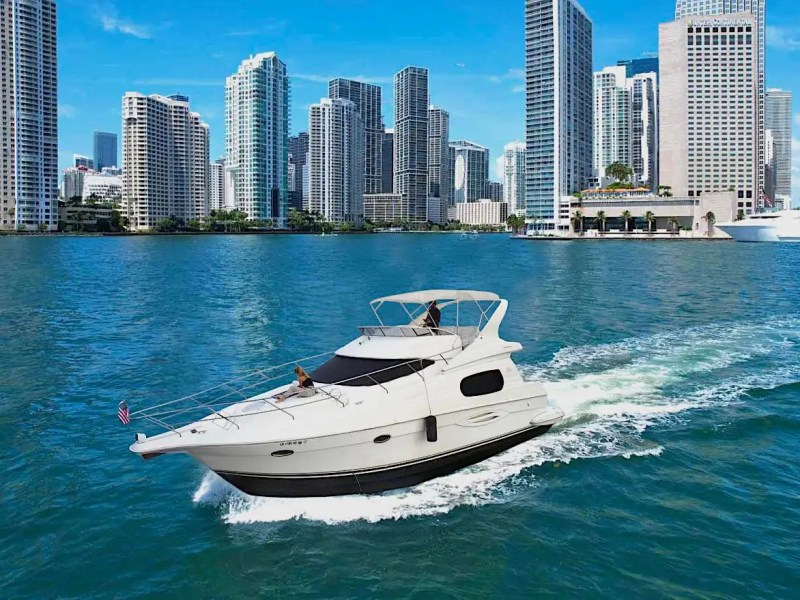 46′ Silverton boat aerial view cruising Miami Beach waters