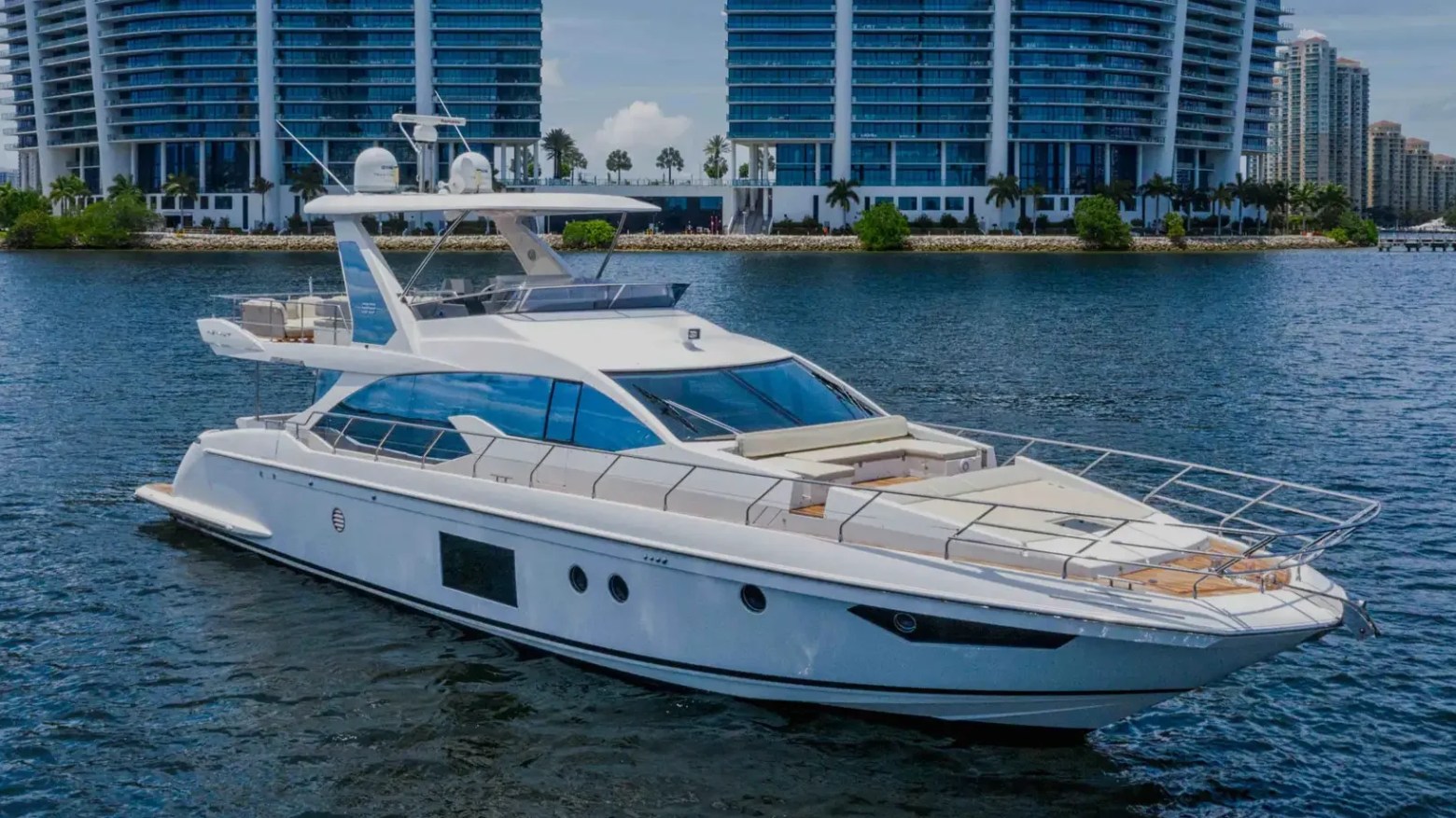 68′ Azimut luxury yacht cruising Miami Beach waters with skyline backdrop
