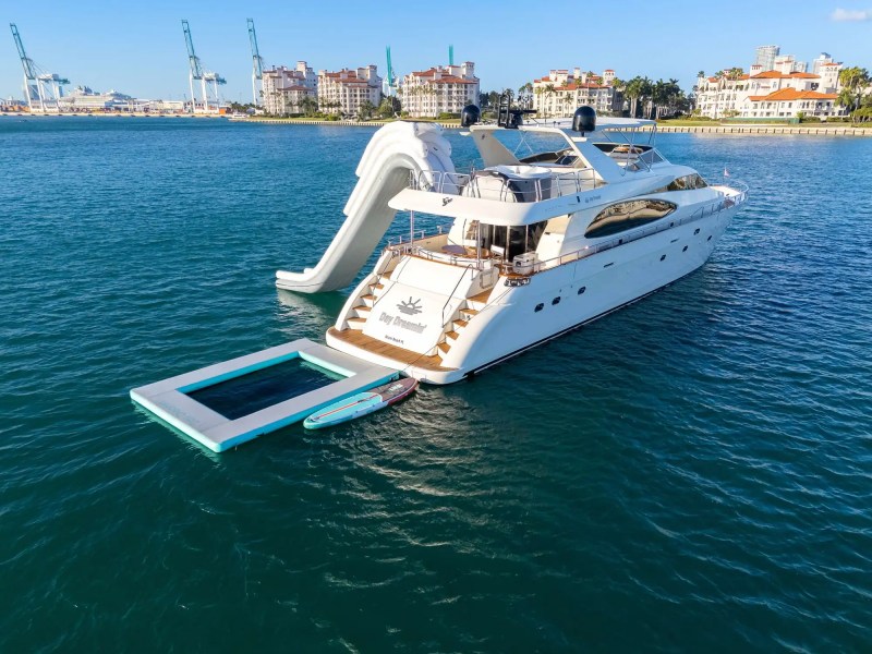 90' Azimut yacht charter inflatable slide floating dock Miami Beach Biscayne Bay aerial view