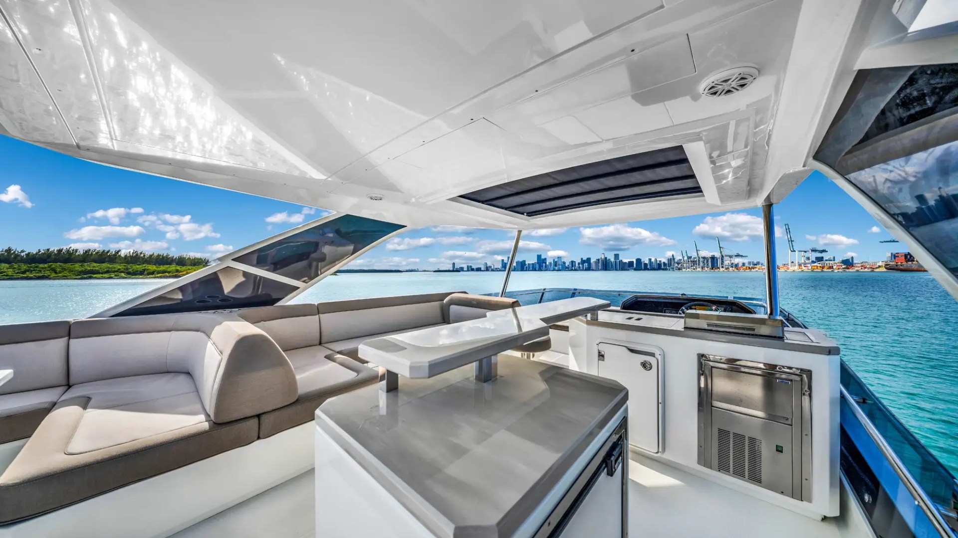 68' Galeon yacht charter Miami Beach aft deck lounge and outdoor bar