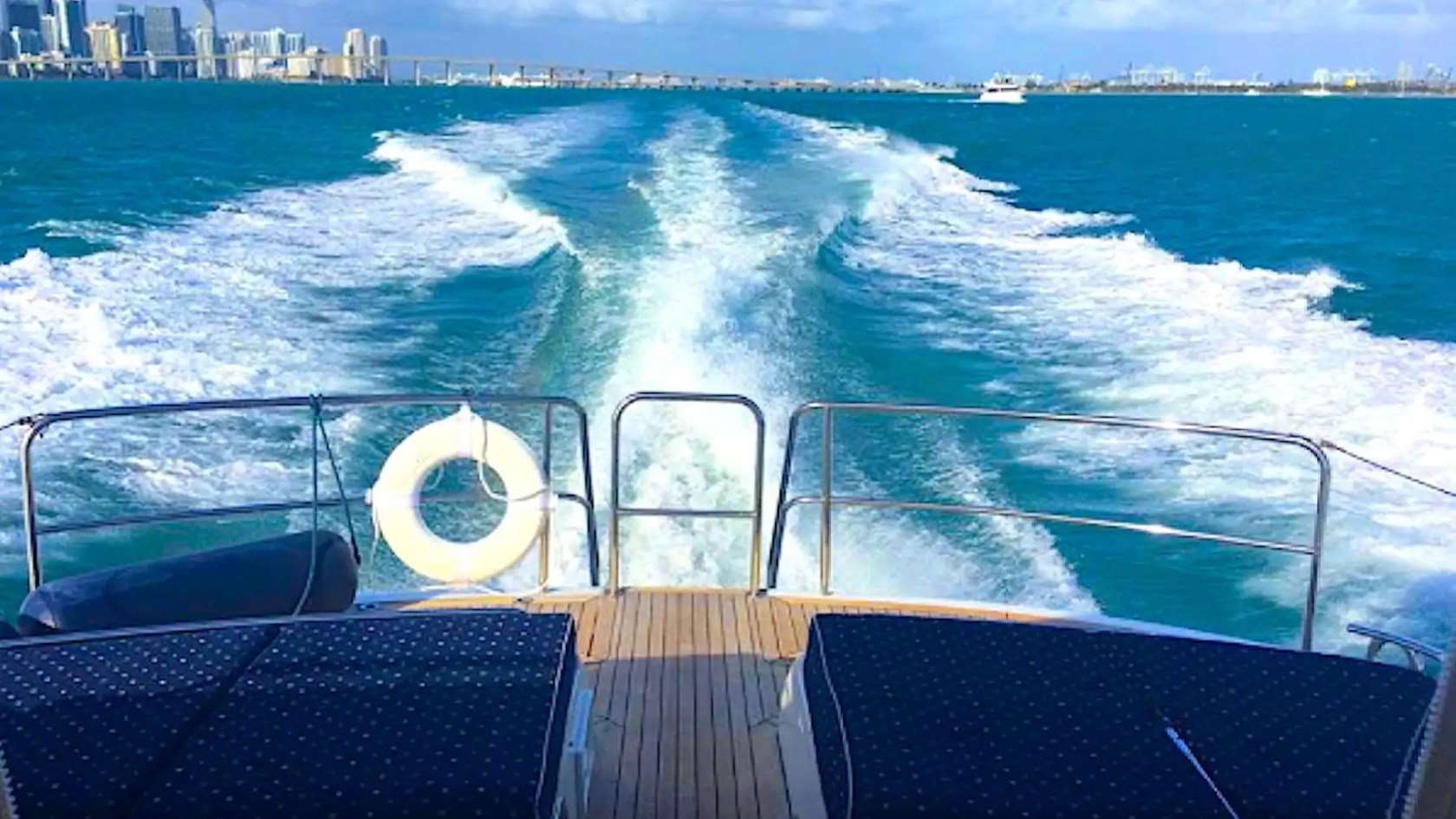 70' Princess yacht charter wake view Miami skyline cruising