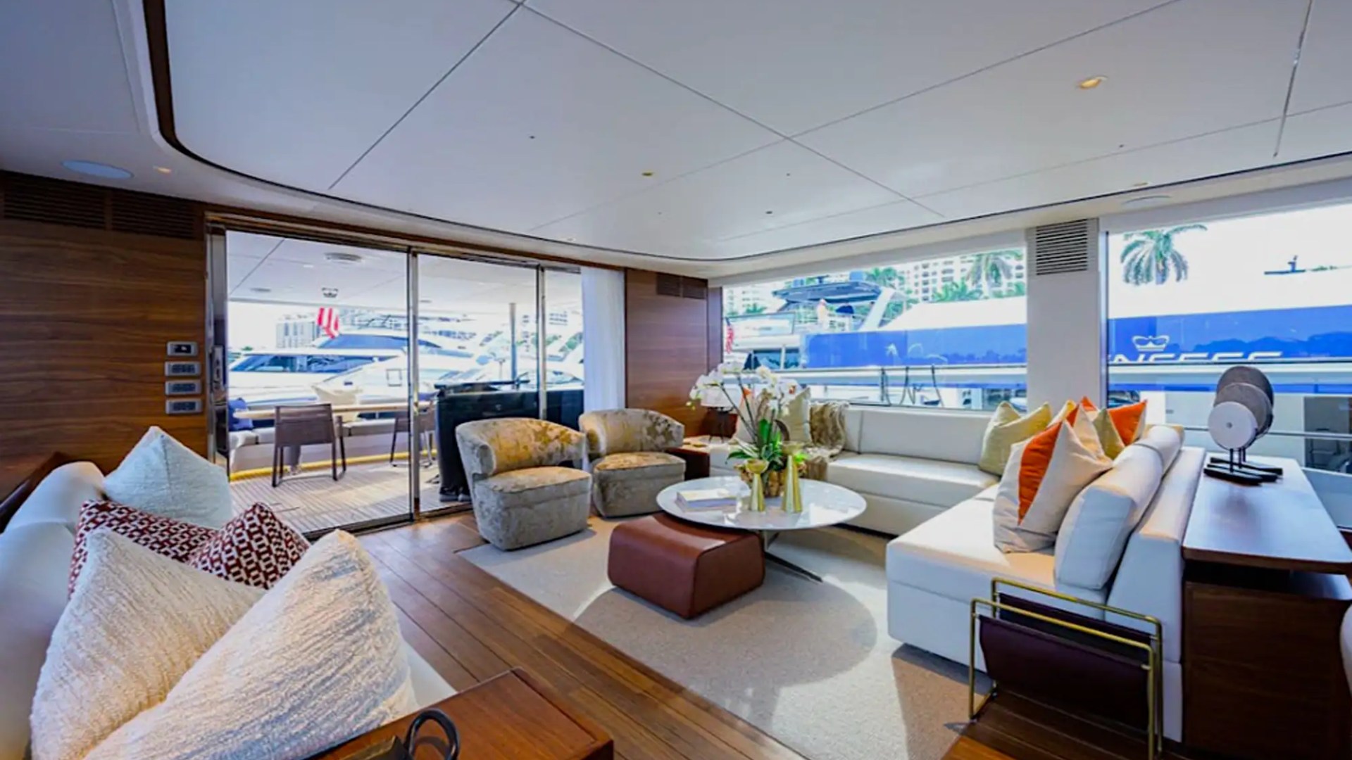 Salon lounge with panoramic windows on 100′ Princess Miami