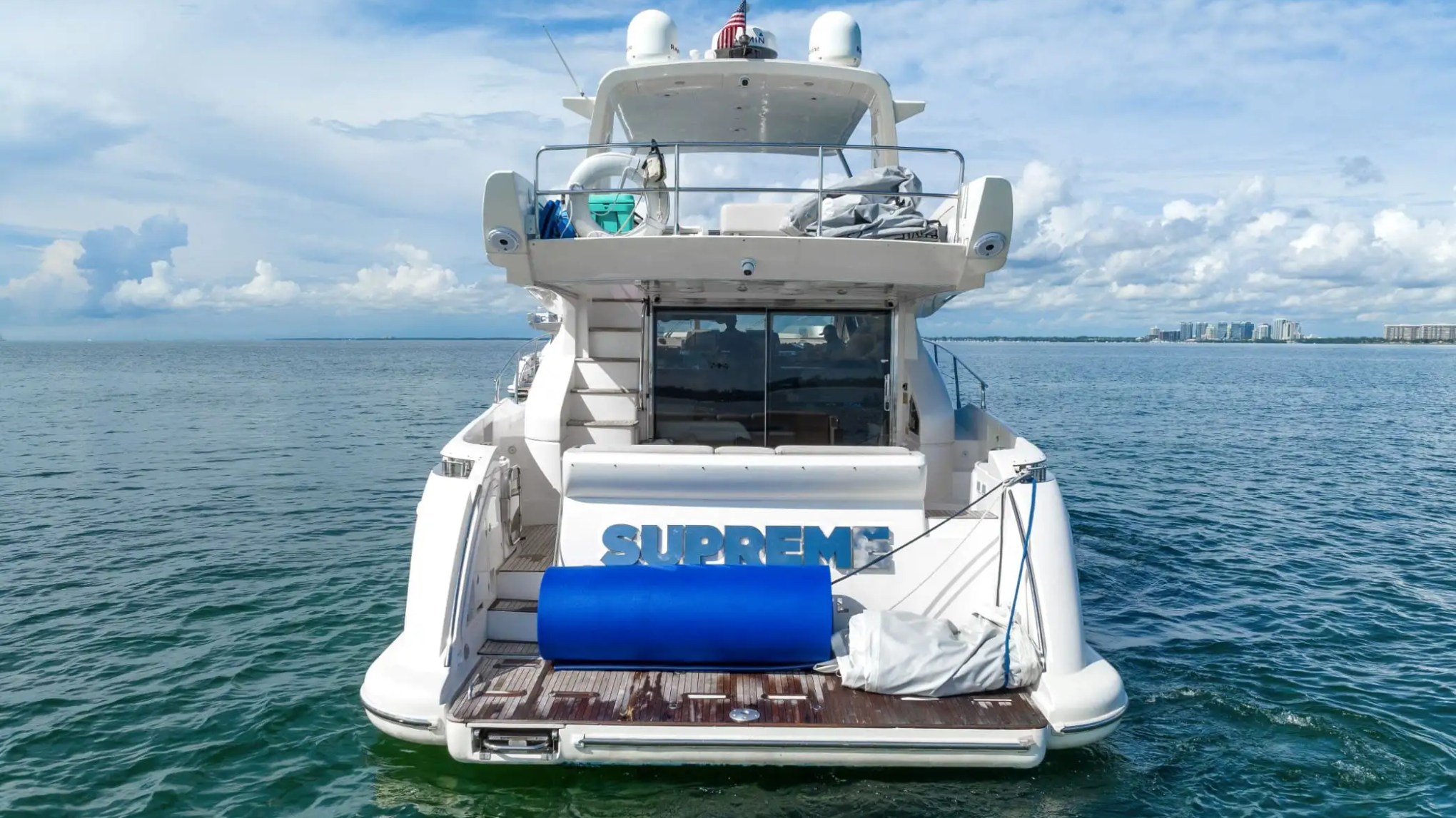 Swim platform on 62′ Azimut luxury yacht rental at anchor in Miami Beach