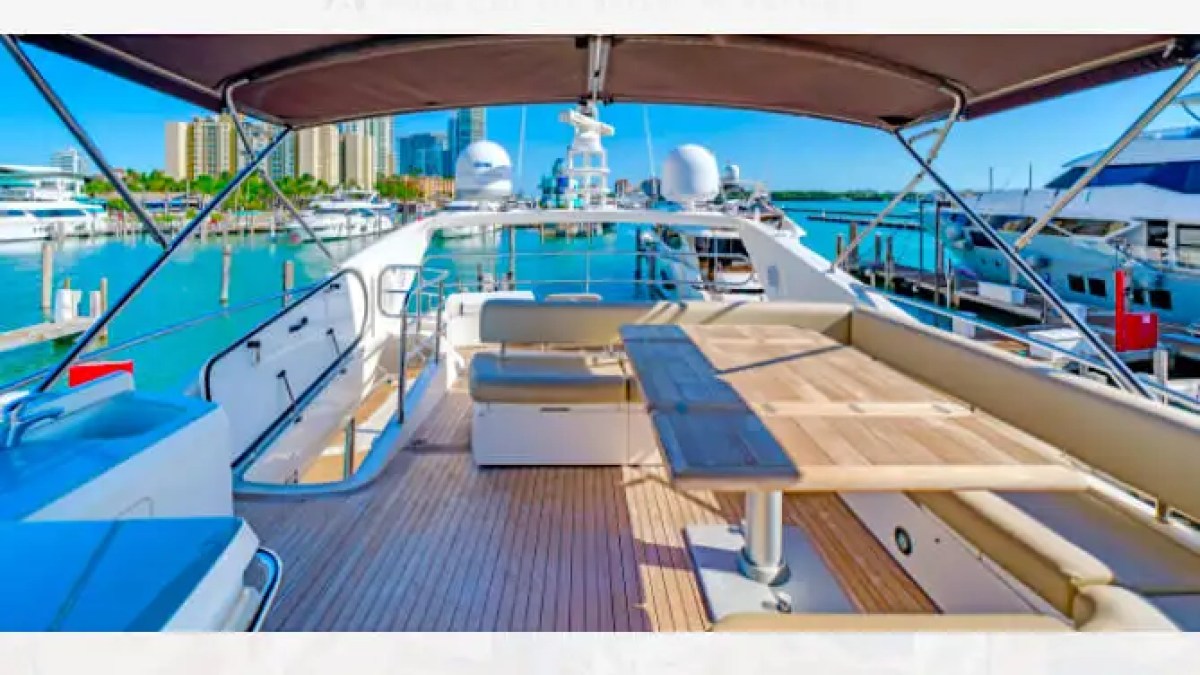 75' Sunseeker yacht charter flybridge dining and lounge area in Miami Beach