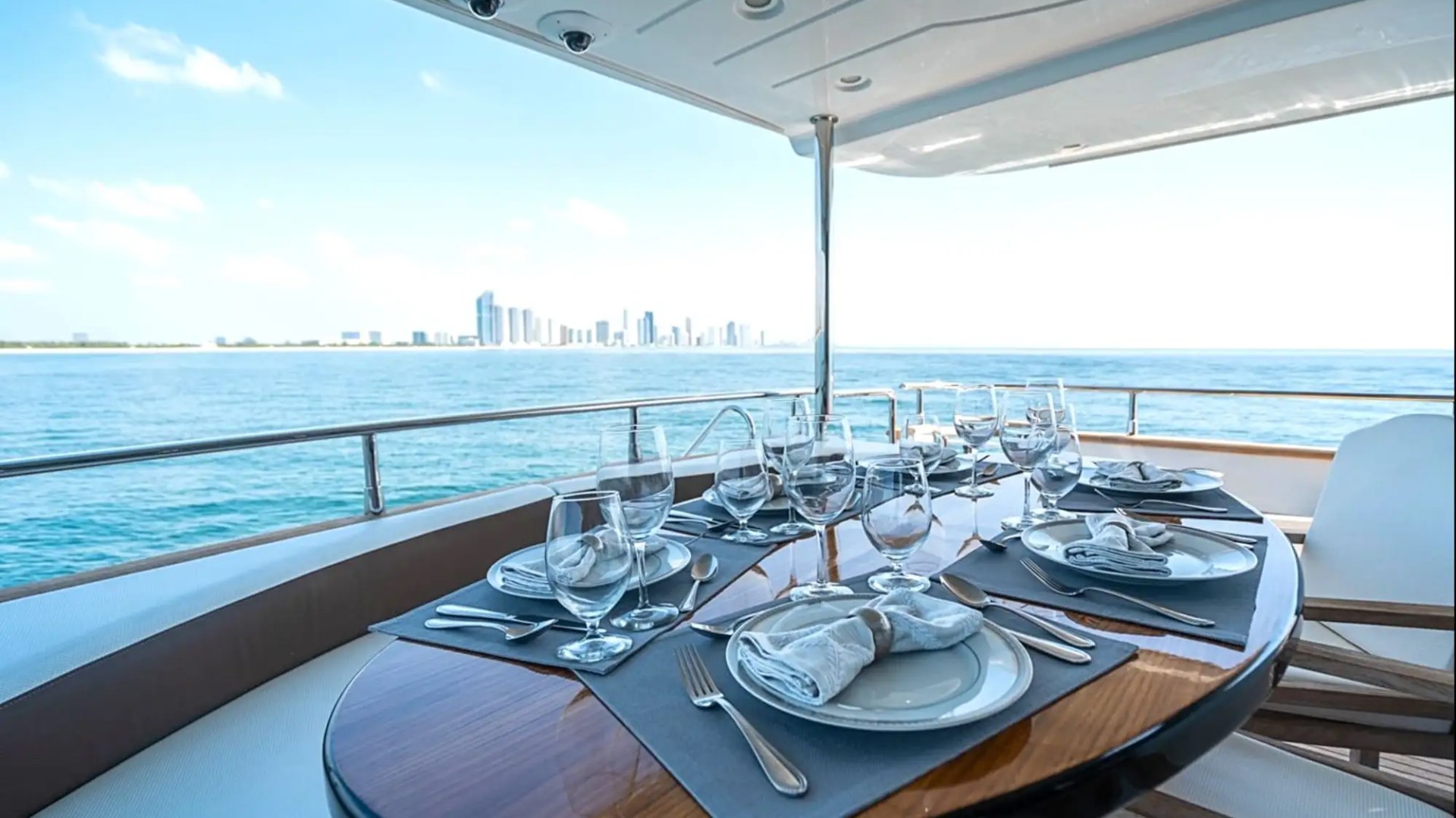 Aft dining setup on 85′ Azimut Miami