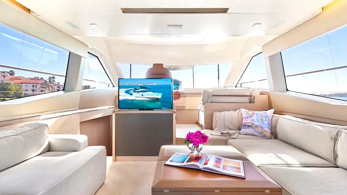 Salon seating and TV inside 62′ Beneteau yacht in Miami Beach