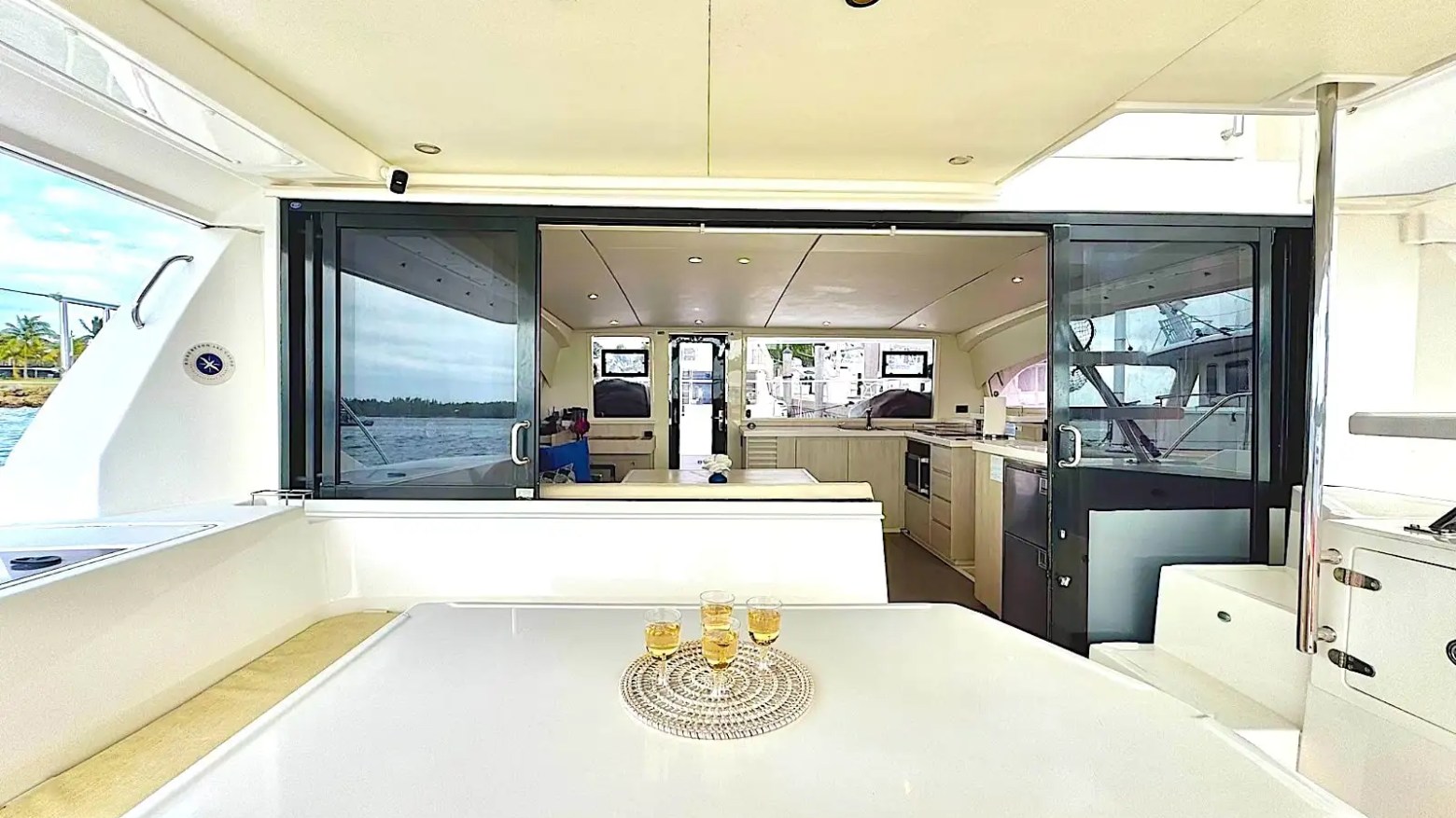 Interior dining area with panoramic water views aboard 43′ Leopard