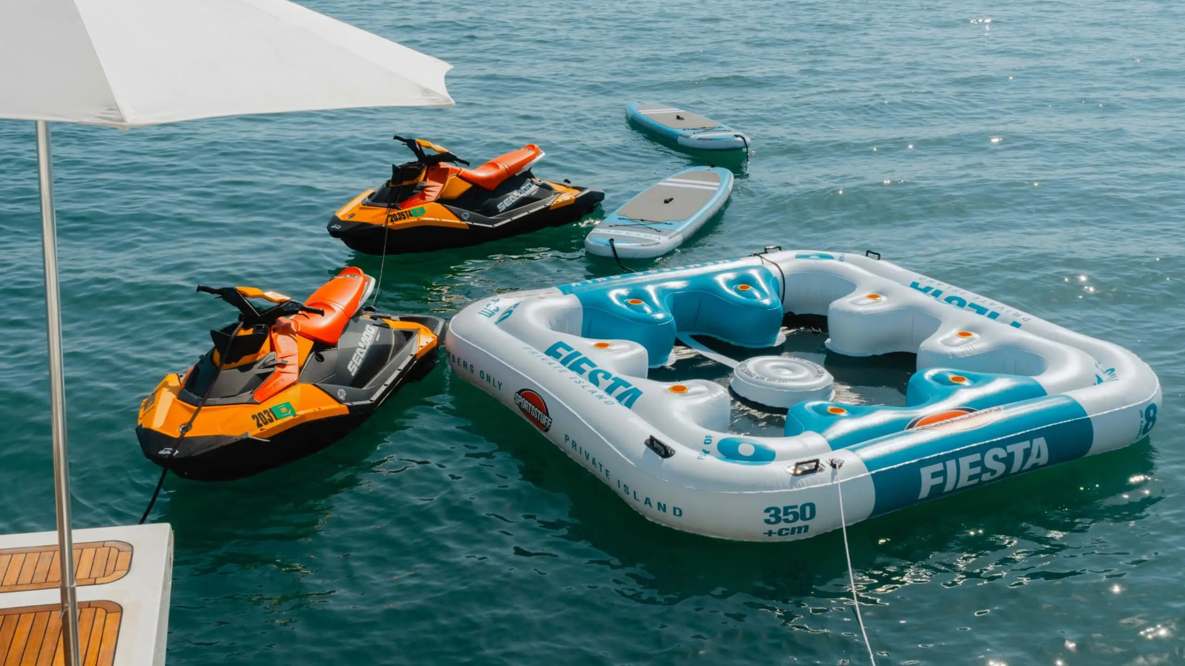Water toys staged on swim platform of 95′ Custom Line Miami