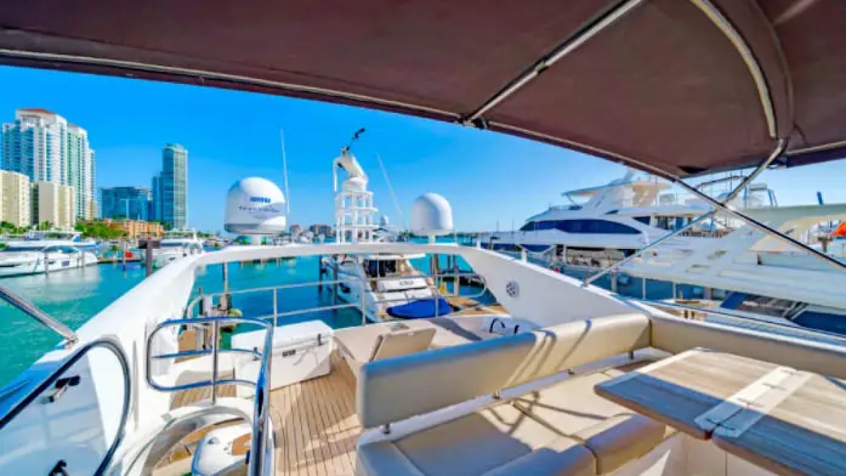 75' Sunseeker yacht charter flybridge lounge seating overlooking Miami Beach marina
