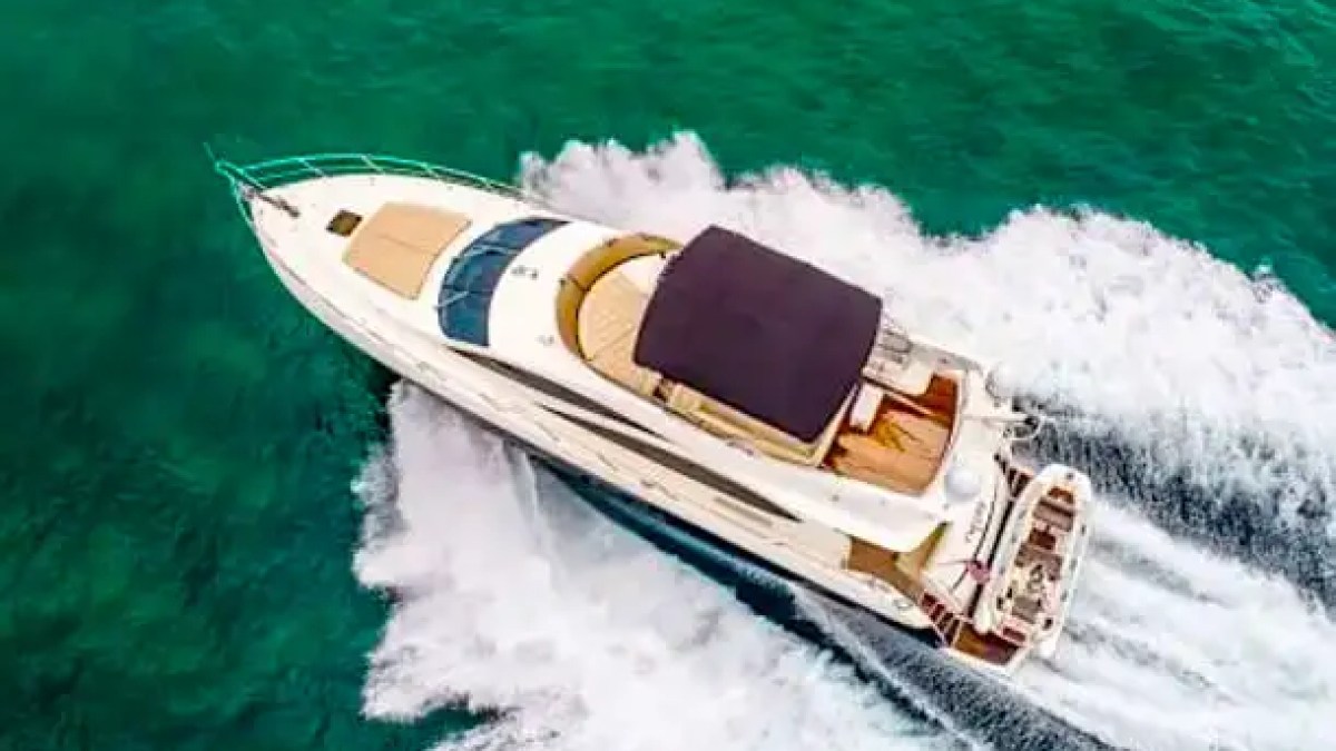 75' Sunseeker yacht charter aerial drone view cruising turquoise waters near Miami Beach