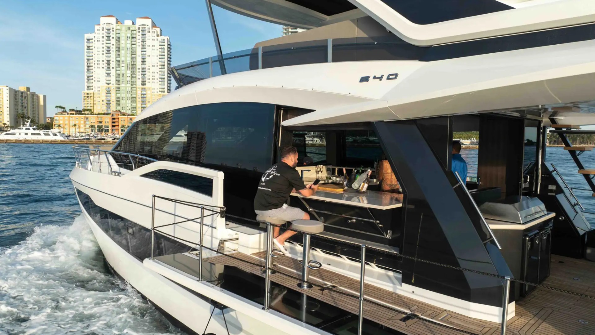 68' Galeon yacht charter Miami Beach side balcony bar seating underway