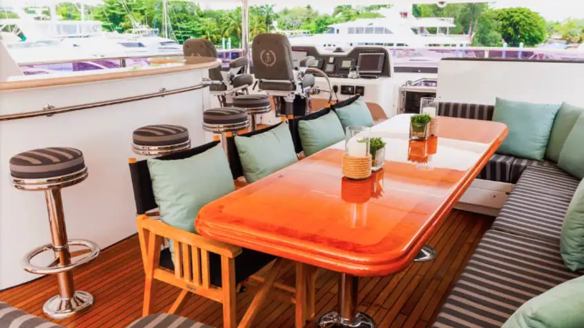 Upper-deck shaded lounge on 103′ Johnson Key Biscayne