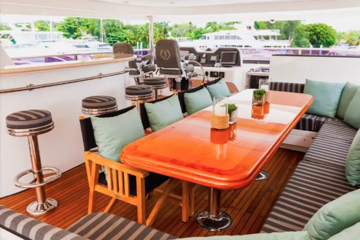 Upper-deck shaded lounge on 103′ Johnson Key Biscayne