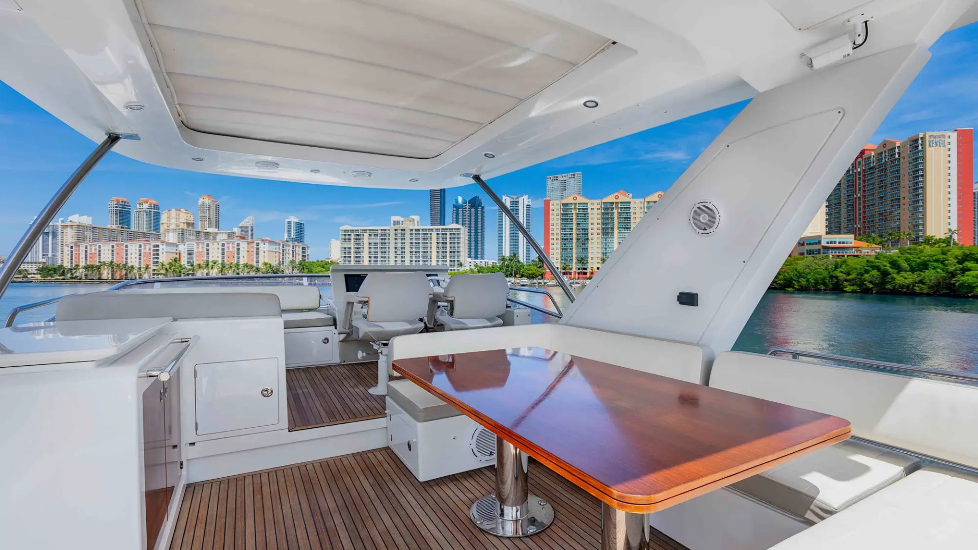 68' Azimut yacht charter Miami flybridge lounge with skyline views