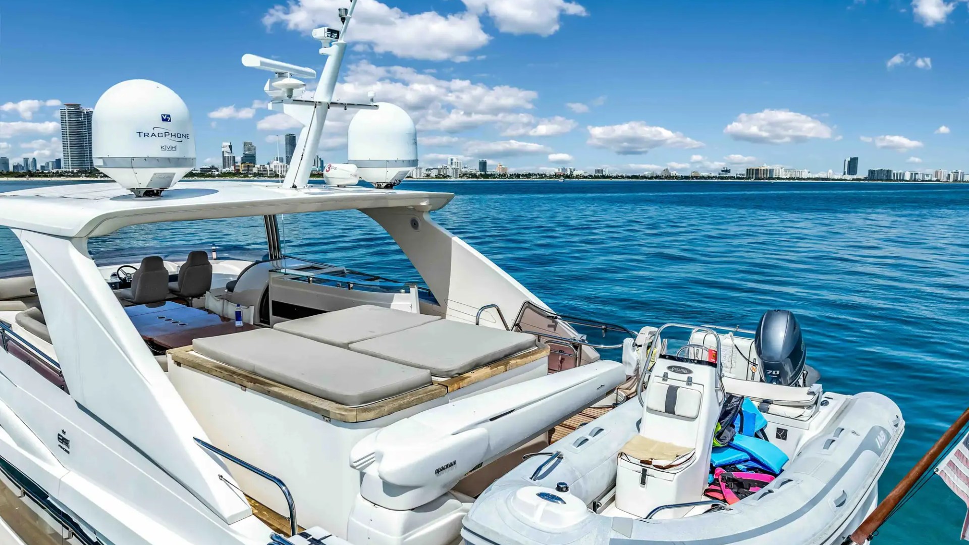 88' Princess yacht charter aft deck lounge and tender Miami Beach Biscayne Bay