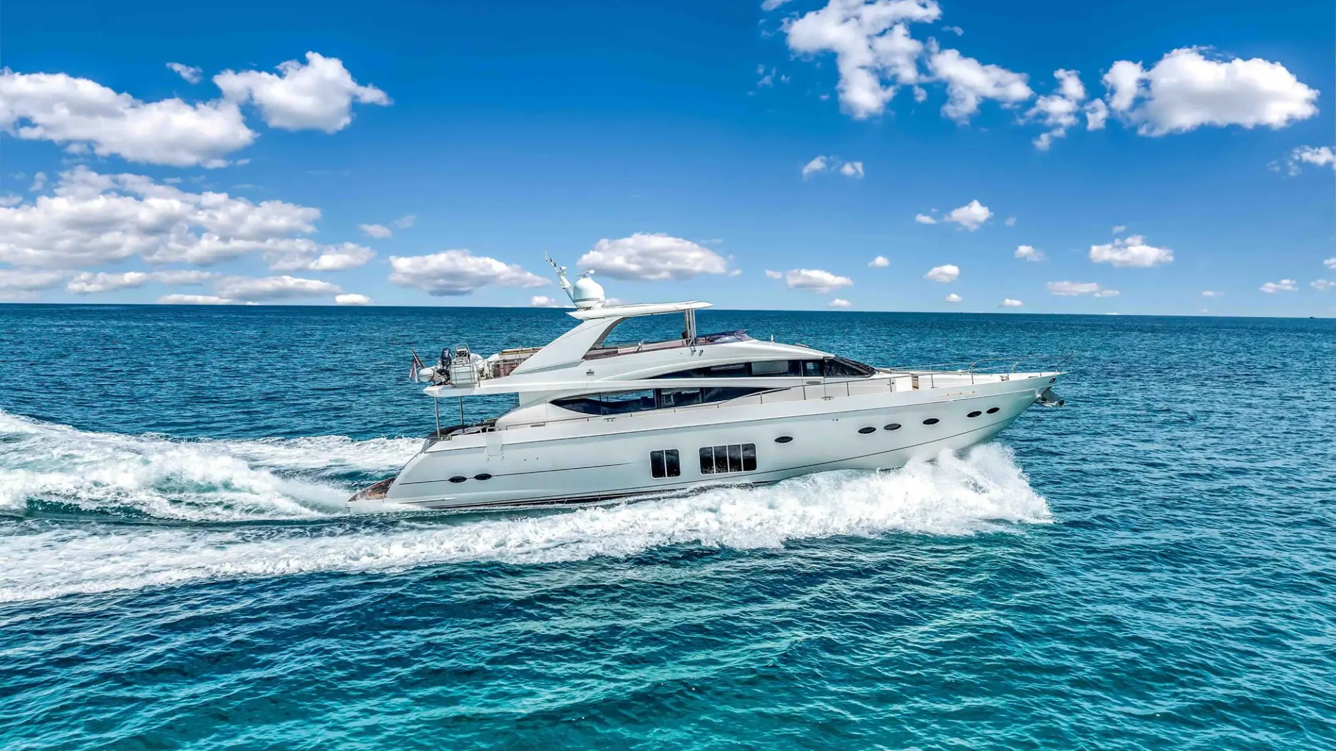 88' Princess yacht charter cruising Miami Beach Biscayne Bay side profile