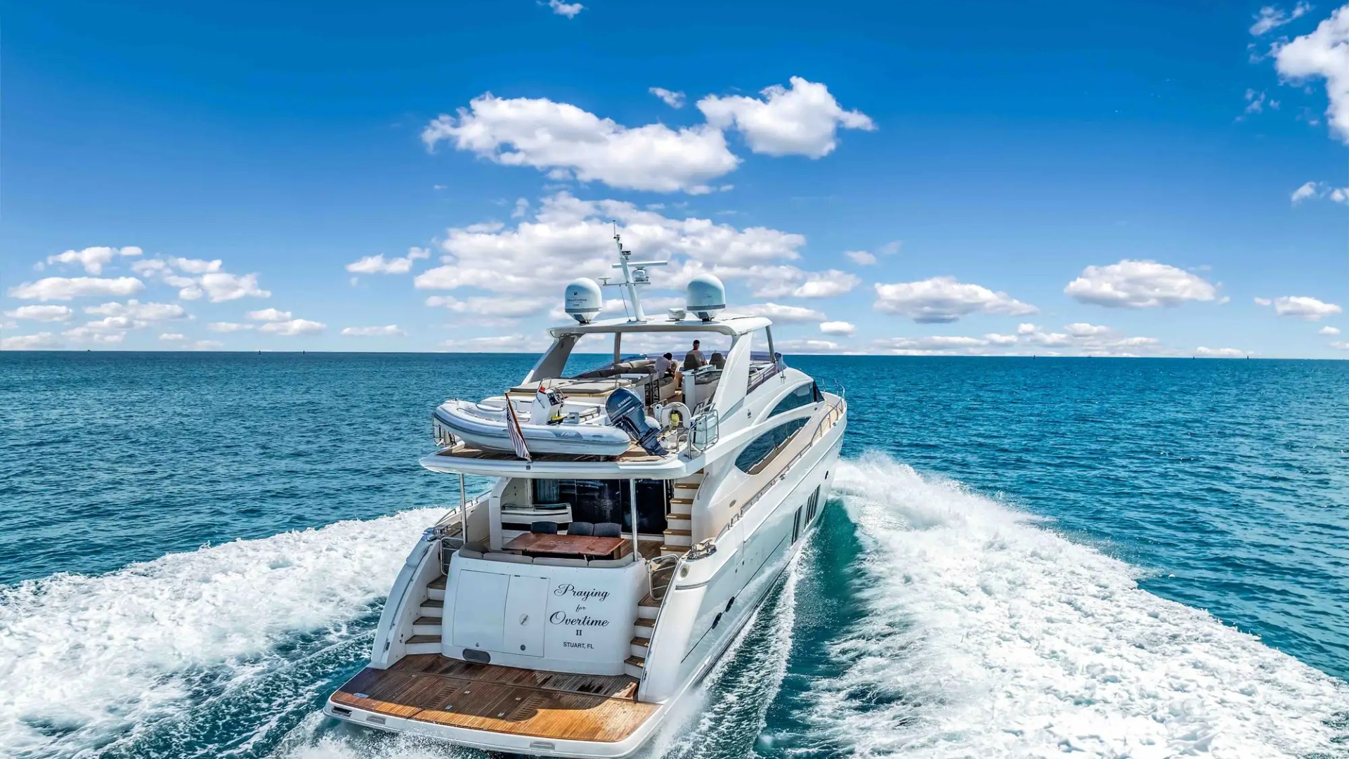 88' Princess yacht charter stern cruising Miami Beach Biscayne Bay wake