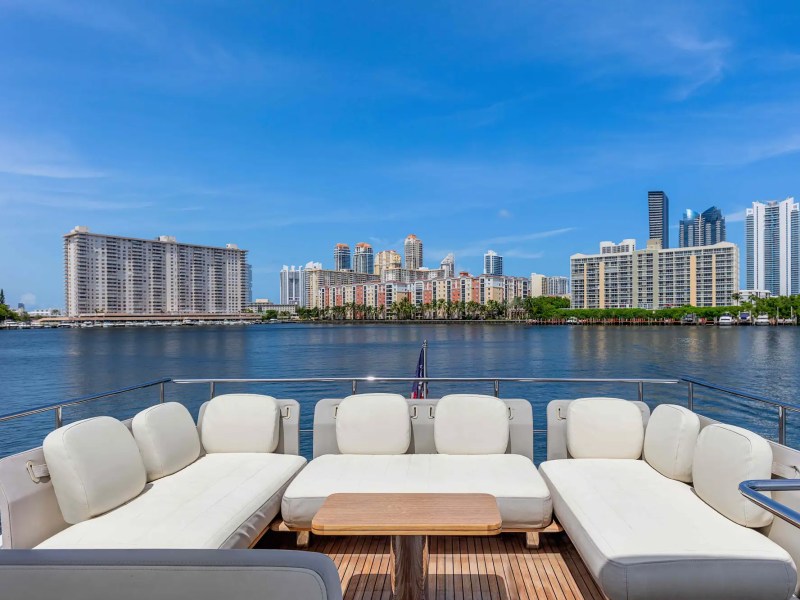 68' Azimut yacht charter Miami aft deck lounge with skyline panorama