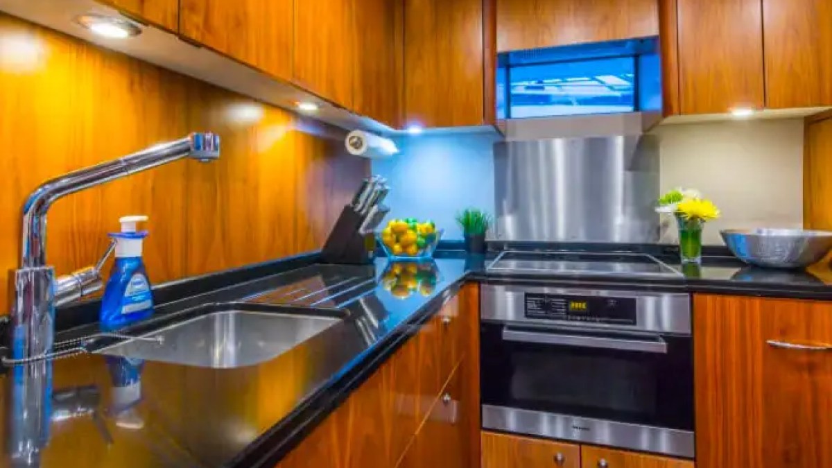 75' Sunseeker yacht charter galley kitchen with stainless appliances in Miami Beach