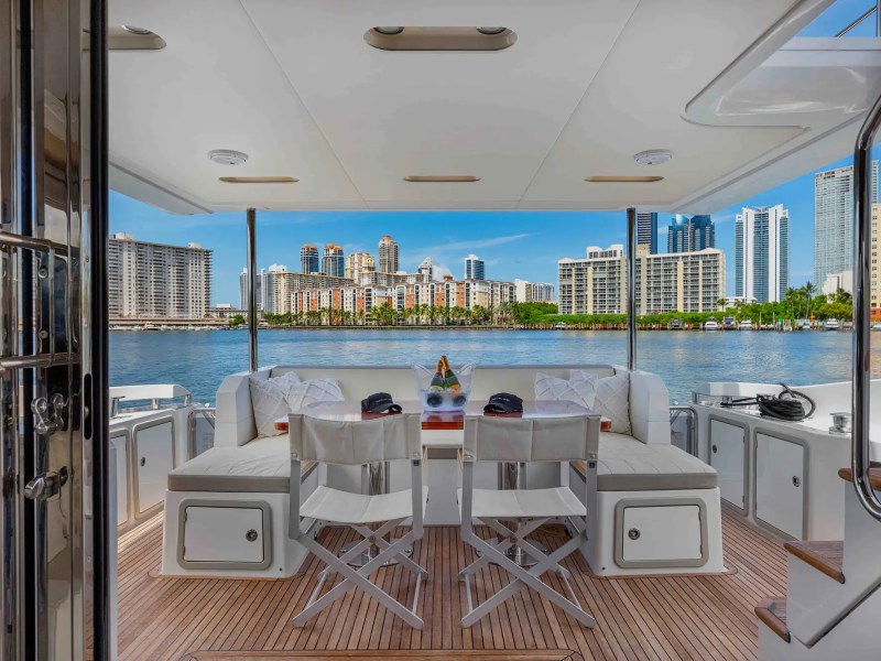 68' Azimut yacht charter Miami aft deck dining with skyline views