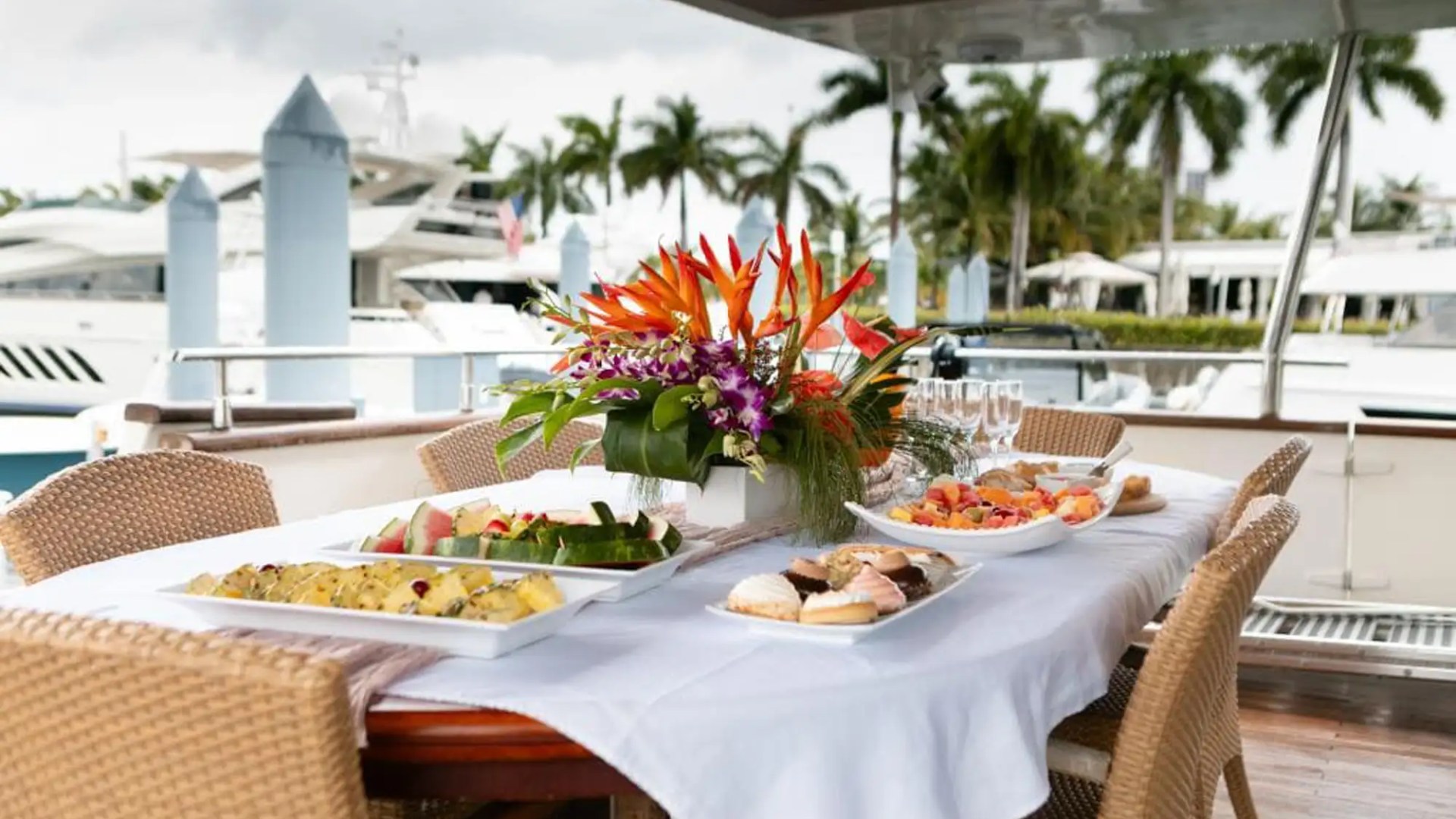 Aft dining table setup on 100′ Azimut Miami
