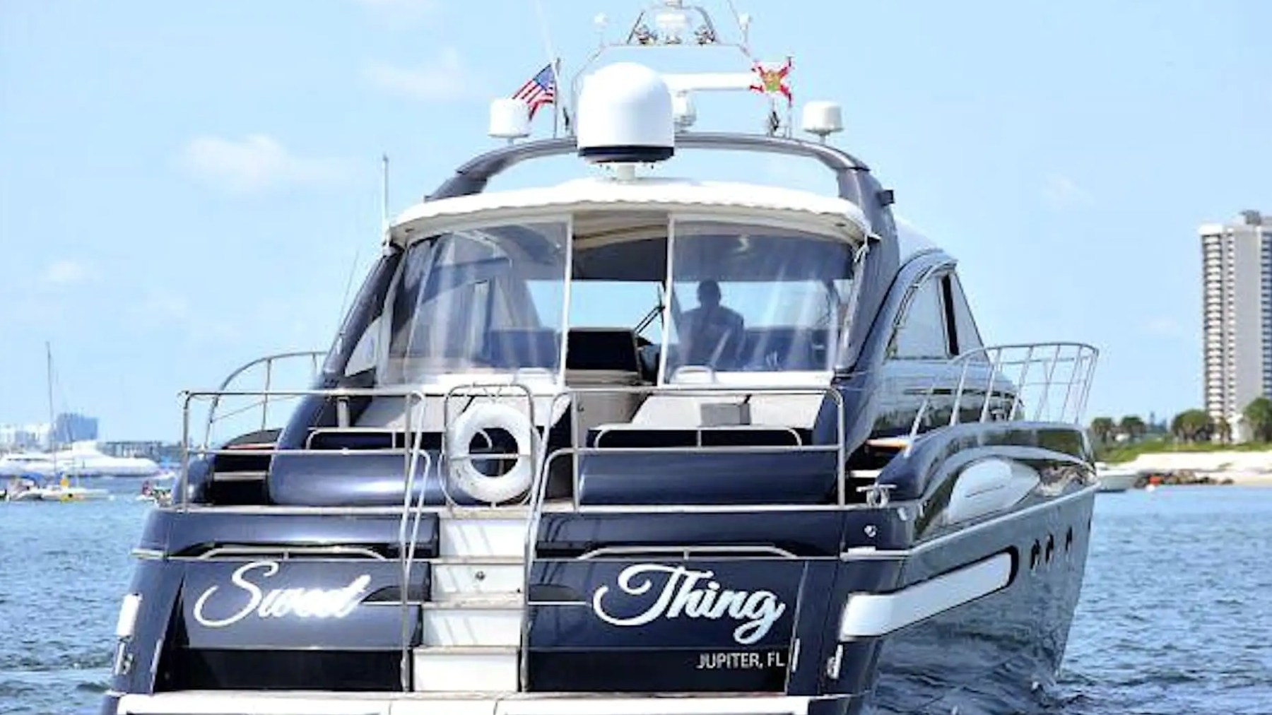 70' Princess yacht charter stern view cruising Miami Beach waters