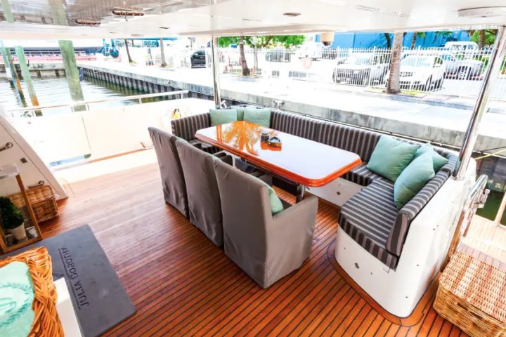 Aft deck lounge seating on 103′ Johnson Key Biscayne