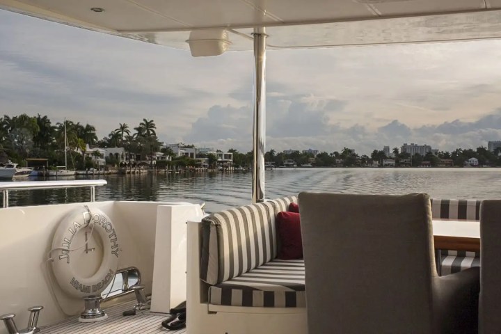 Stern leisure zone with ottomans on 103′ Johnson Key Biscayne