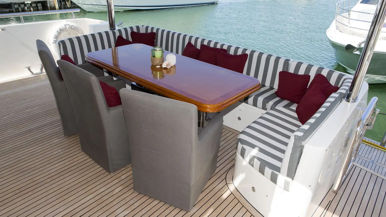 Terrace seating with teak flooring on 103′ Johnson Key Biscayne