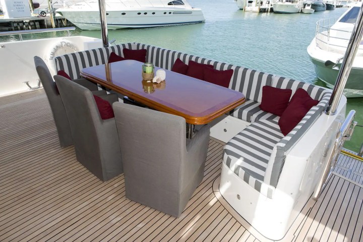 Terrace seating with teak flooring on 103′ Johnson Key Biscayne