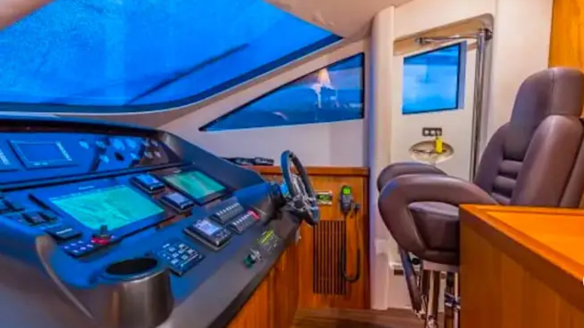 75' Sunseeker yacht charter helm station with navigation controls in Miami Beach
