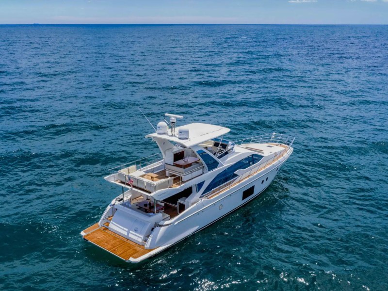 Aerial drone view of 68 foot Azimut flybridge yacht charter cruising Miami ocean waters