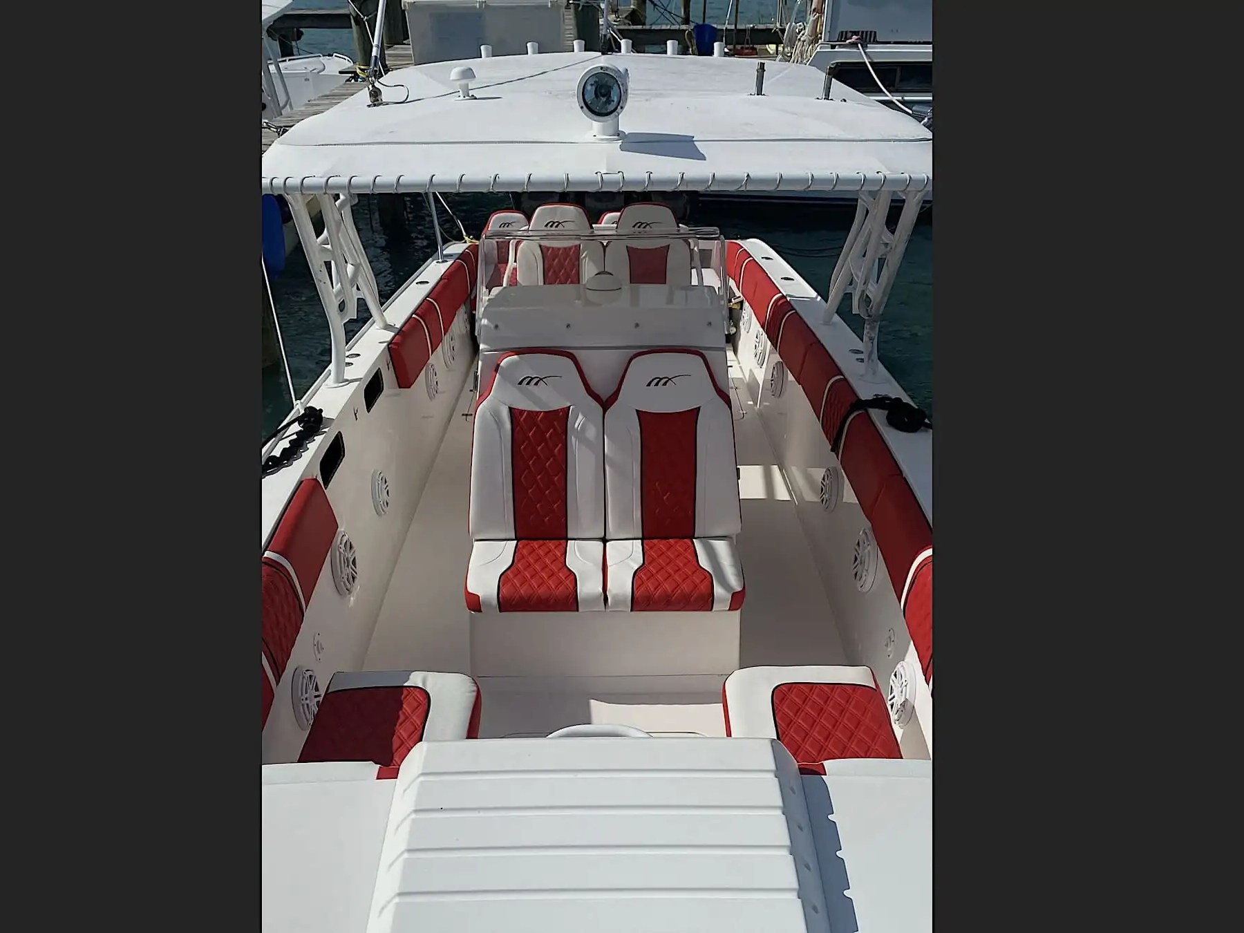 Premium red and white passenger seating aboard a 35' Marlin Boat Rental in Nassau, Bahamas, featuring spacious open-deck comfort for island hopping and private coastal excursions.