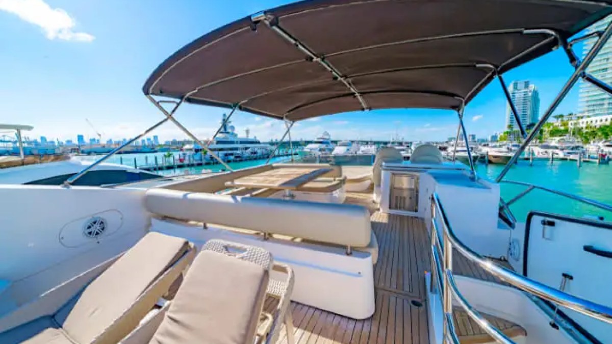 75' Sunseeker yacht charter flybridge seating with Miami skyline views