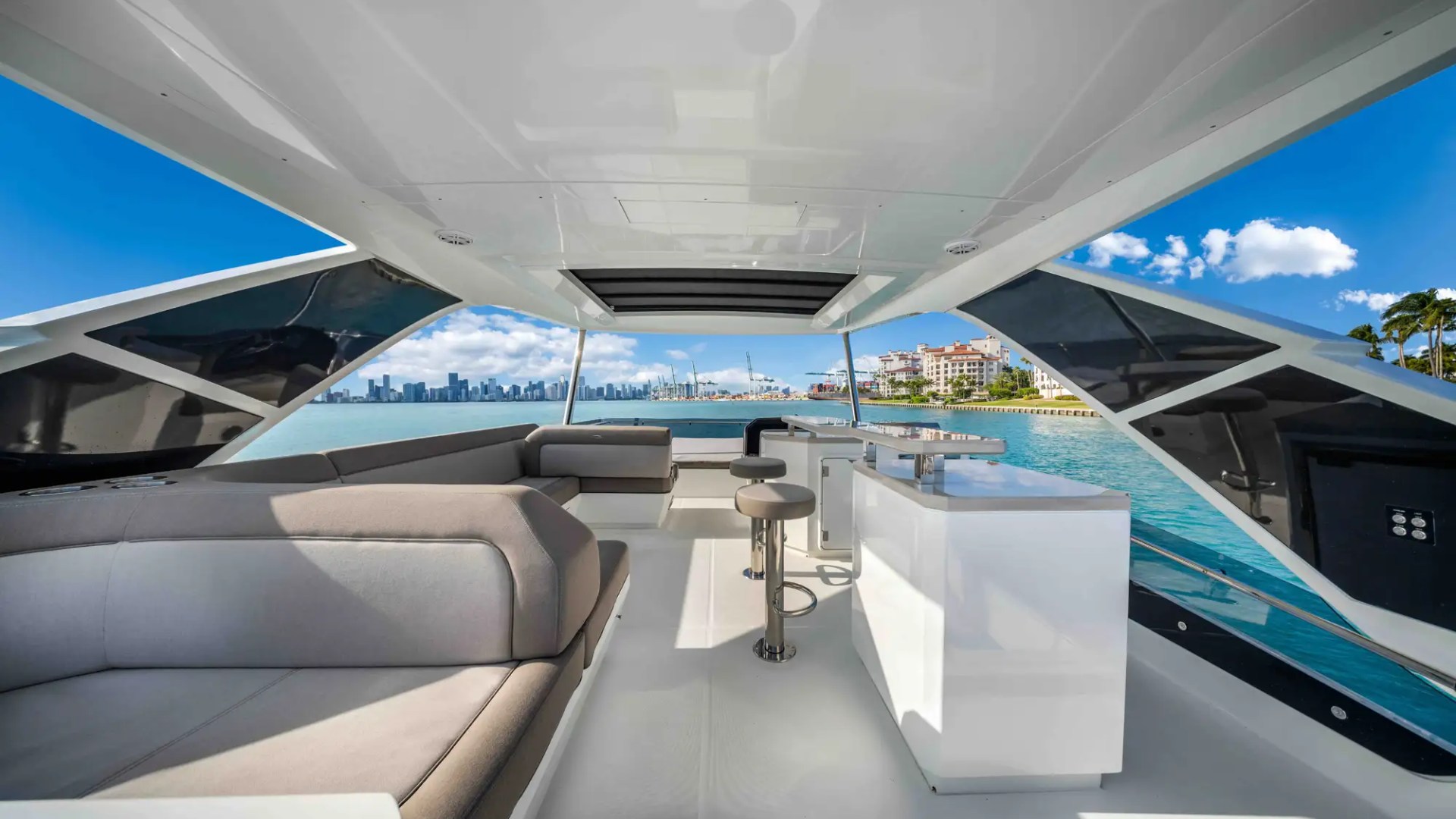 68' Galeon yacht charter Miami flybridge lounge and bar with skyline views