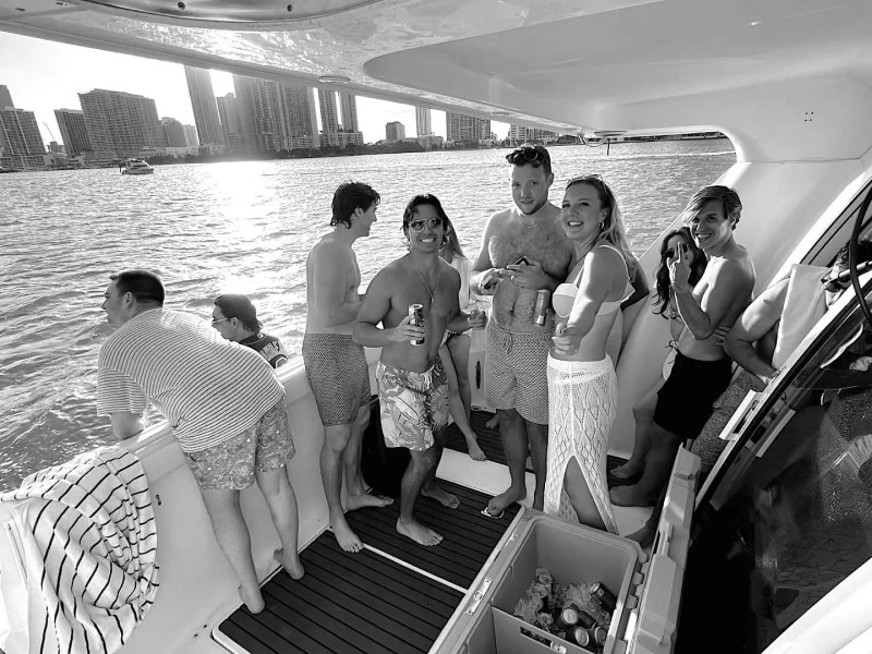 46′ Silverton boat guests lounging aft deck