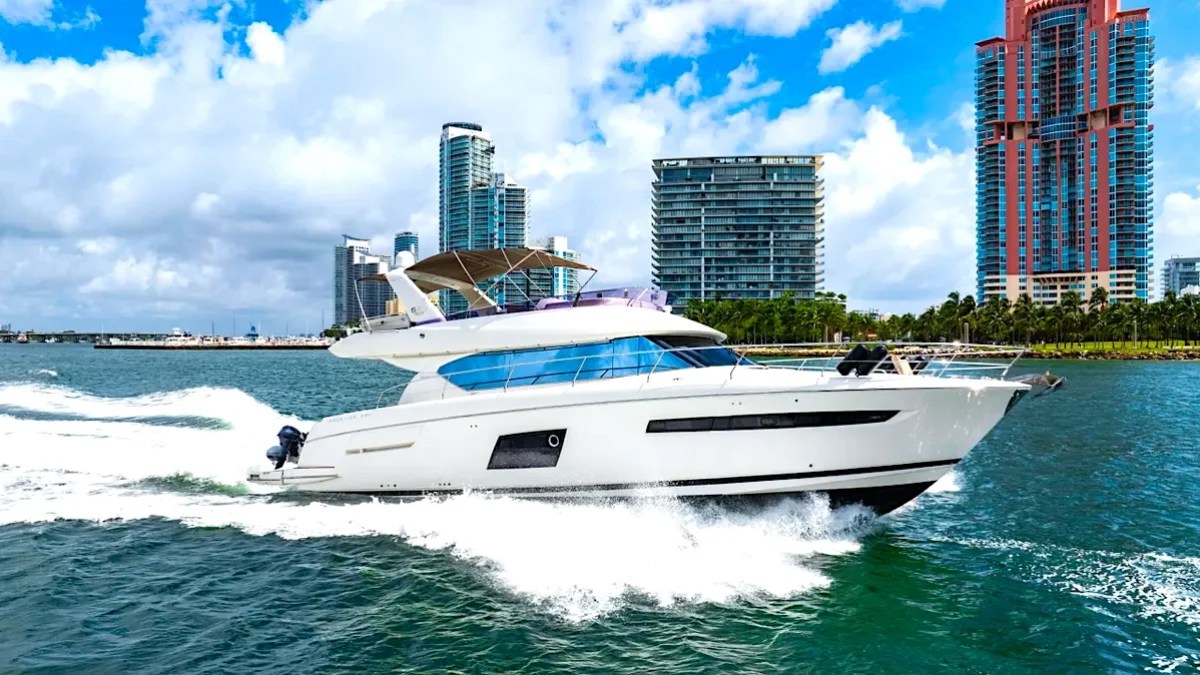 62′ Prestige yacht side profile with skyline backdrop