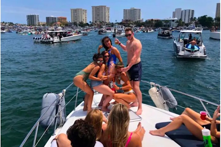 48' Formula boat guests celebrating on the bow in Miami Beach