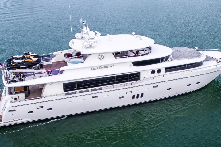 Resort-style upper deck loungers on 103′ Johnson Key Biscayne