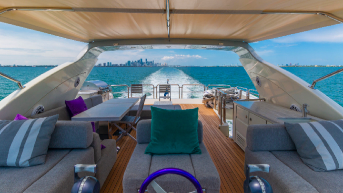Flybridge helm and lounge seating on 103′ Azimut Miami