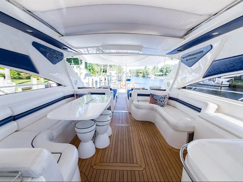 70' Princess yacht charter Miami Beach cockpit lounge dining area