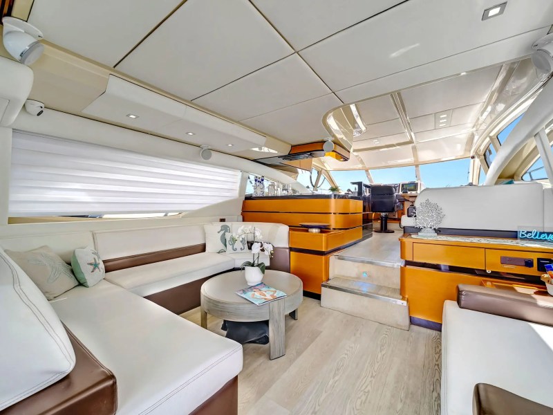 Interior salon of 62′ Azimut yacht with panoramic windows