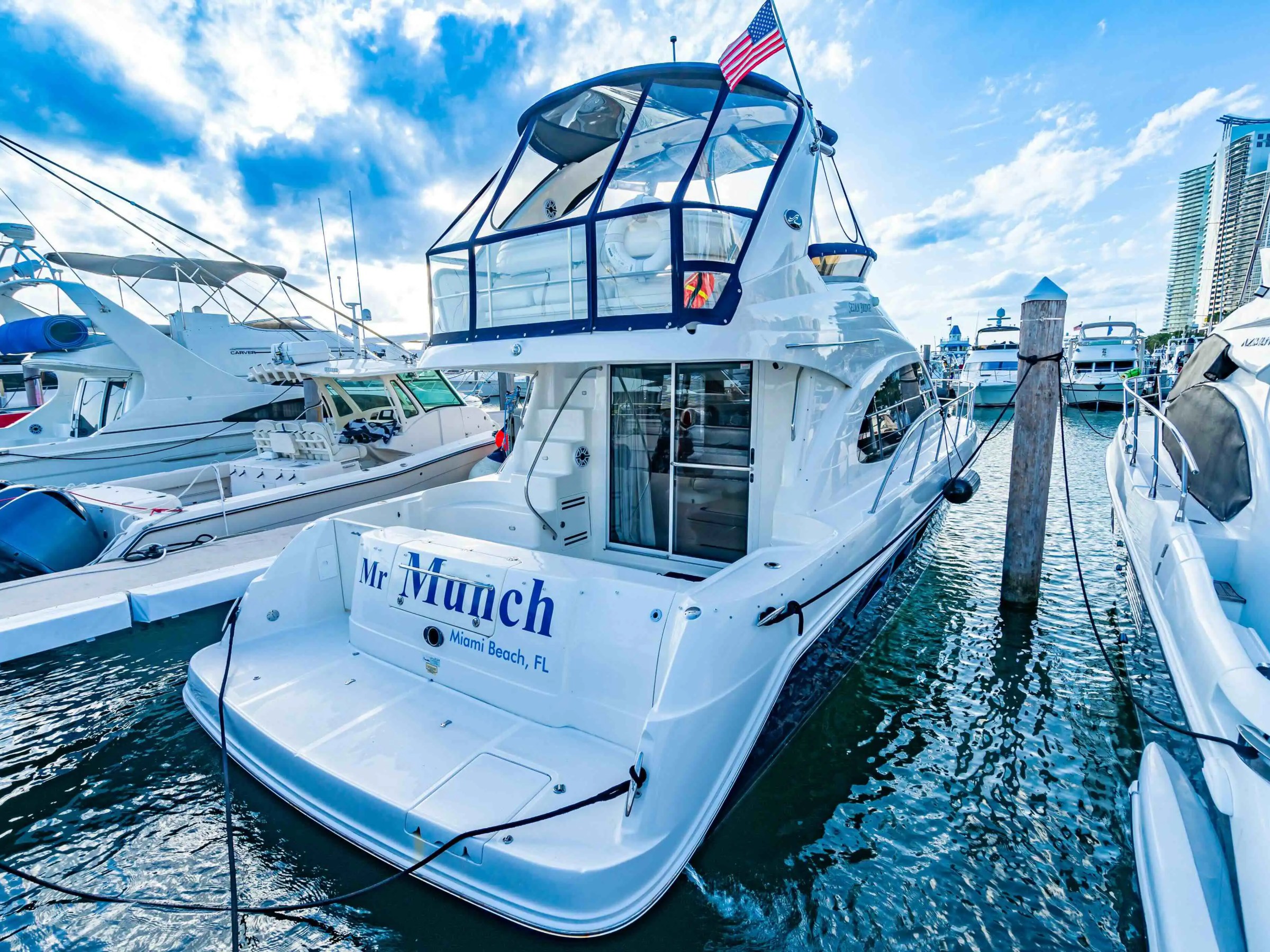 Guests relaxing aft deck on 50′ Sea Ray Miami