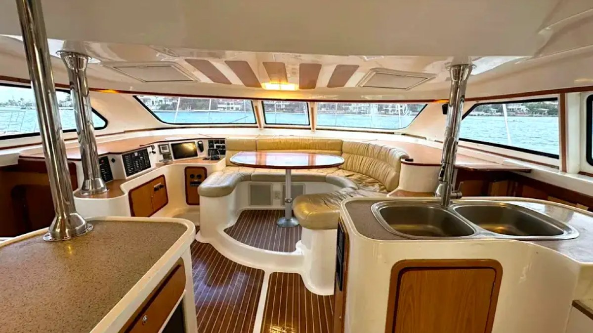 Dining and galley area on 52′ Africat Miami