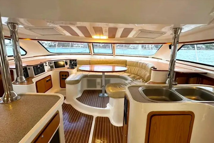 Dining and galley area on 52′ Africat Miami