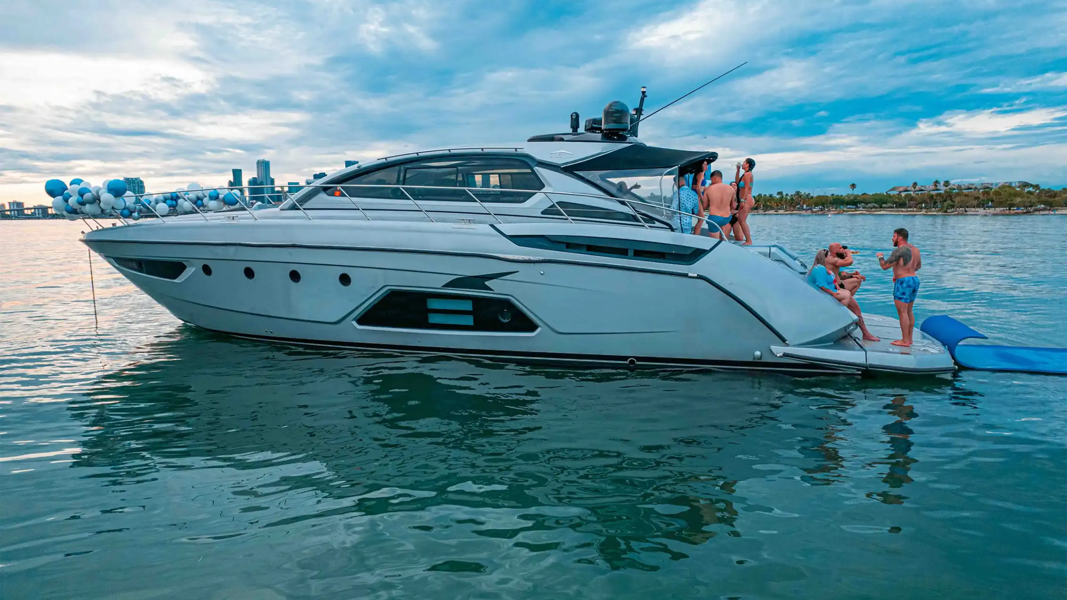 Stern view of 64′ Atlantis Miami with magic carpet deployed